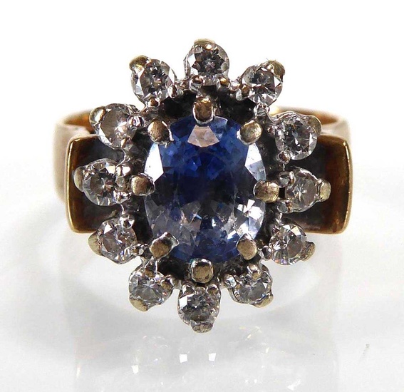 A 9ct yellow gold cluster ring set pale blue stone...