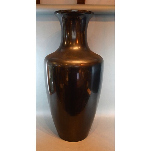 A Black Glass Floor Vase of Oviform 77 cms tall