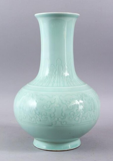 A CHINESE CELADON PORCELAIN MOULDED VASE, the body with