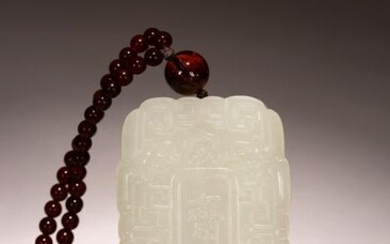 A CHINESE WHITE JADE RECTANGULAR PLAQUE WITH BEADS