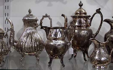A COLLECTION OF EDWARDIAN TEAPOTS AND CREAMERS