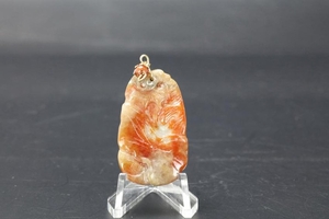 A Chinese Coral Red Jadeite Pendant