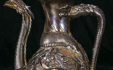 A Chinese Export dragon silver teapot
