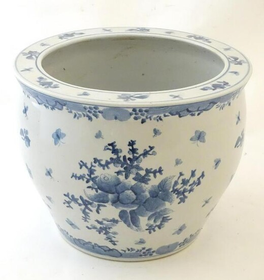 A Chinese blue and white planter / jardiniere decorated