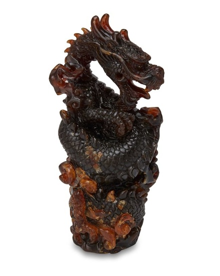 A Chinese carved amber figure of a dragon