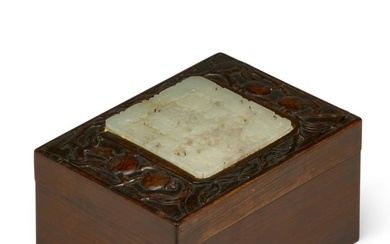 A Chinese jade plaque mounted on a hardwood box