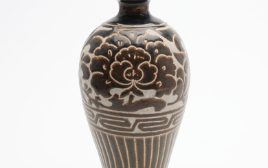 A Chinese meiping vase, cizhou type, with decoration depicting peonies in low relief, possibly late Qing (1644-1912).