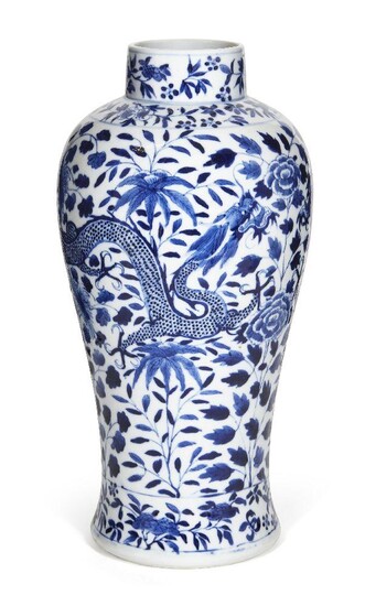A Chinese porcelain blue and white 'dragons and peonies' baluster vase, 19th century, painted with a pair of four-clawed dragons amongst flowering peony blossoms and leafy stems, apocryphal underglaze blue four-character Kangxi mark to base, 31cm...