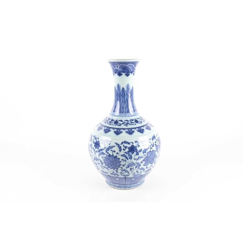 A Chinese porcelain blue & white lotus vase, late Qing, the ...