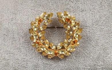 signed, mounted with yellow and tawny stones, 6cm 2.5in. diameter...