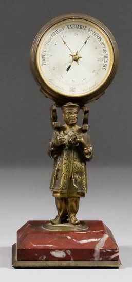 A French Desk Aneroid Barometer, 19th Century, supported on...