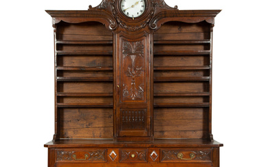 A French Provincial Carved Walnut Clock-Inset Vaissellier