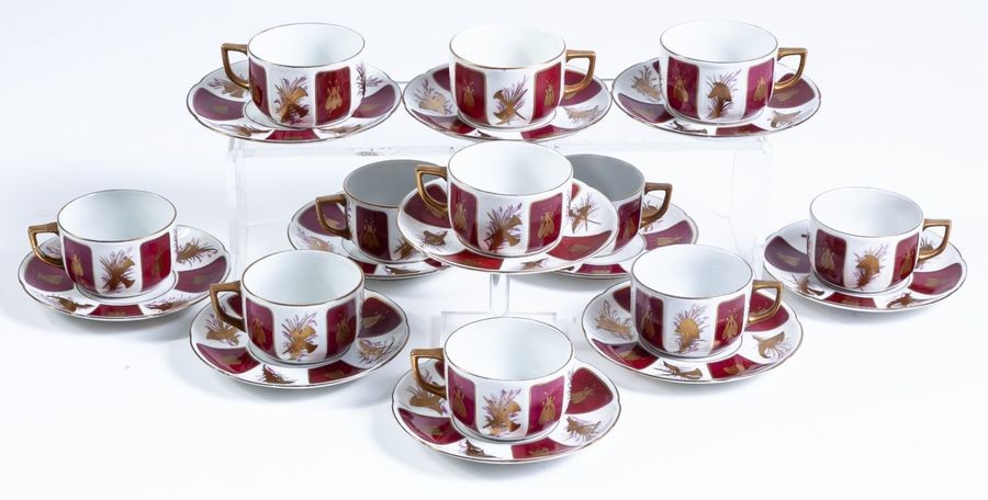 A French parcel-gilt porcelain coffee set. Eleven cups...