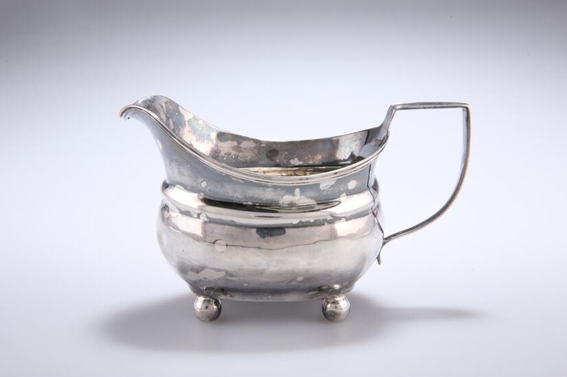 A GEORGE III SILVER CREAM JUG, London 1810, with reeded