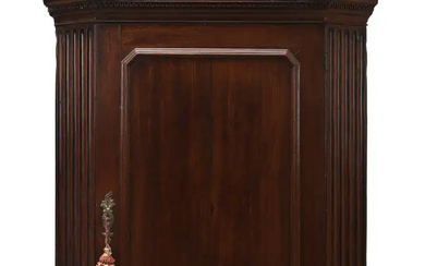 A George III mahogany corner cupboard, last quarter 18th century, the moulded...
