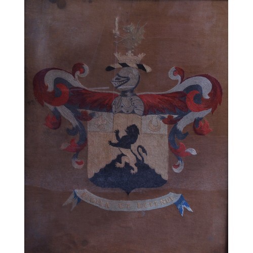A George III needlework armorial panel, worked in coloured t...