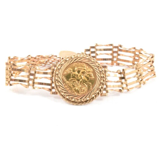 A Gold Half Sovereign gate link bracelet.