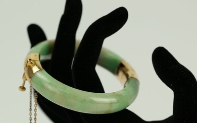 A Green Jadeite 18K Gold Decorated Bangle with Safety
