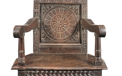 A James I joined oak panel-back 'caqueteuse' open armchair, Salisbury, circa 1625