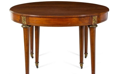 A Louis XVI Style Gilt Metal Mounted Walnut and