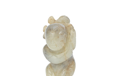 A MOTTLED JADE CARVING OF A BOY Ming Dynasty