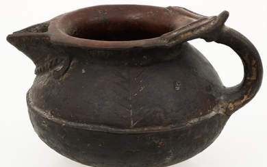 A Northern-Indian cooking pot with ear and spout, mid. 20th century.