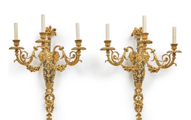 A PAIR OF LOUIS XVI STYLE TWO-TONE GILT BRONZE AND BLUED STEEL WALL LIGHTS AFTER THE MODEL BY FRANÇOIS RÉMOND, THIRD QUARTER 19TH CENTURY