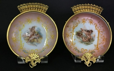 A PAIR OF ORMOLU MOUNTED OPALINE WALL PLAQUES