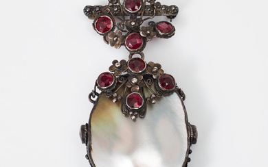 A PENDANT, silver, set large mother-of-pearl plate, faceted garnets, circa 1900.