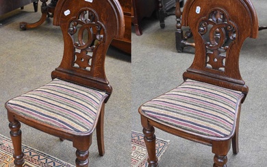 A Pair of Late 19th century Oak Hall Chairs, arched...