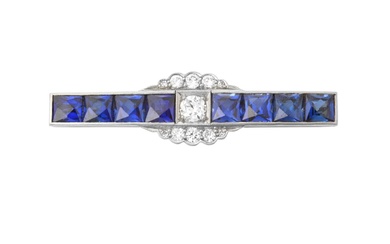 A Synthetic Sapphire and Diamond Brooch the central round brilliant...