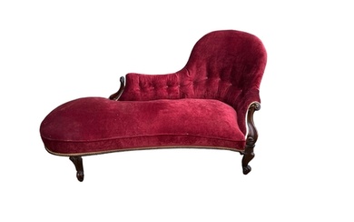 A VICTORIAN MAHOGANY CHAISE LOUNGE In wine red velvet uphols...