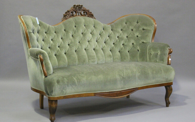 A Victorian mahogany showframe settee, upholstered in buttoned blue velour, height 108cm, width 166c