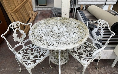 A Victorian style white painted cast metal three piece patio...