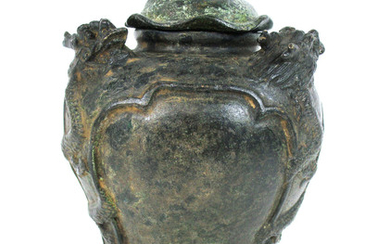A bronze jar with cover