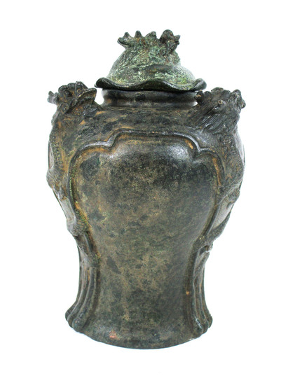 A bronze jar with cover