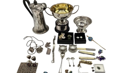 A collection of silver and white metal items