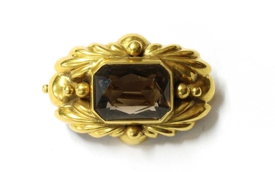 A gold smoky quartz brooch