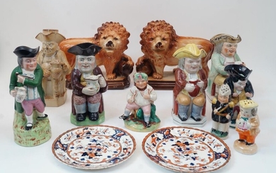 A group of Staffordshire ceramics, 19th century and later, to include a salt glazed stoneware Toby jug modelled as a seated gentleman with foaming quart in hand, 27cm high; a Toby jug modelled as a gentleman in green jacket with a pipe and mug of...