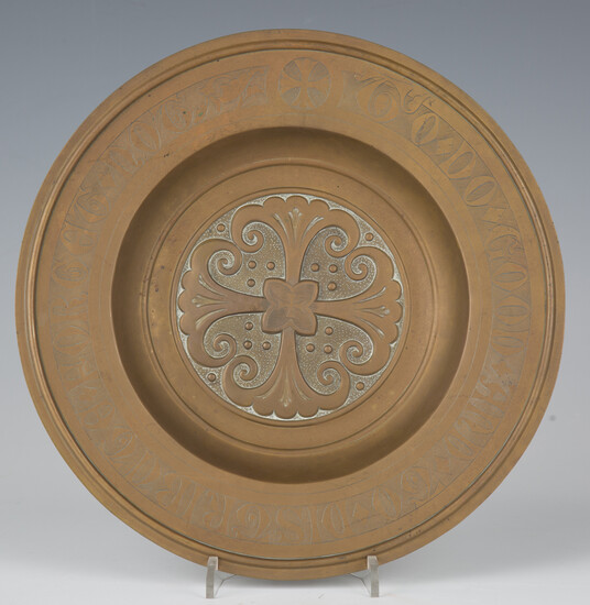 A late 19th/early 20th century gilt brass ecclesiastical collection plate, the rim inscribed 'F