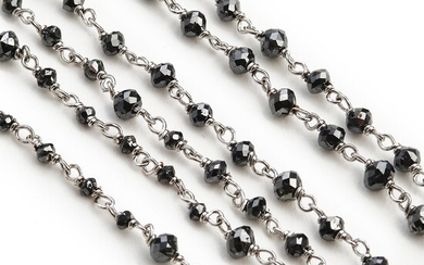 A long diamond necklace set with numerous briolette-cut black diamonds, mounted in 18k white gold. L. app. 89 cm.
