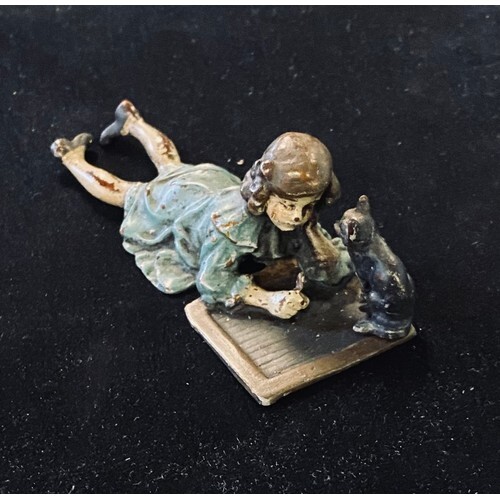 A painted bronze group, of a young girl and a cat, 10.5 cm w...