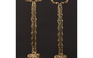 A pair of 19th century brass door stops, each cast as a lion...