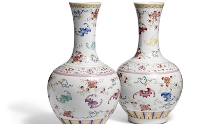 A pair of Chinese famille rose ‘bat and shou’ porcelain vases. Marked Qianlong, but 19th century. H. 44 cm. (2)