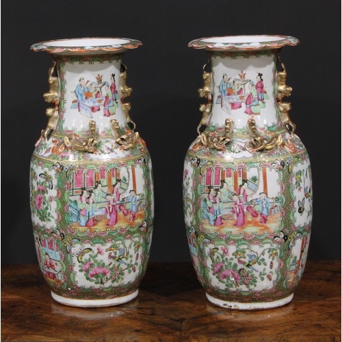 A pair of Chinese famille rose ovoid vases, painted in the t...