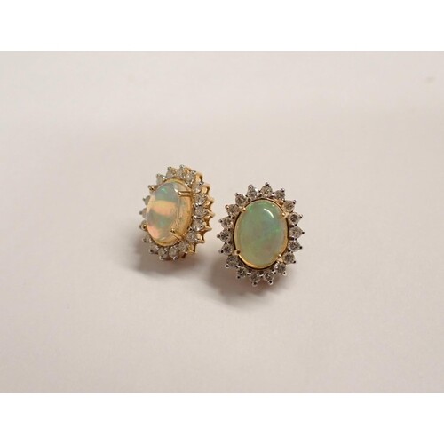 A pair of Opal and Diamond Cluster Earrings each claw-set ov...