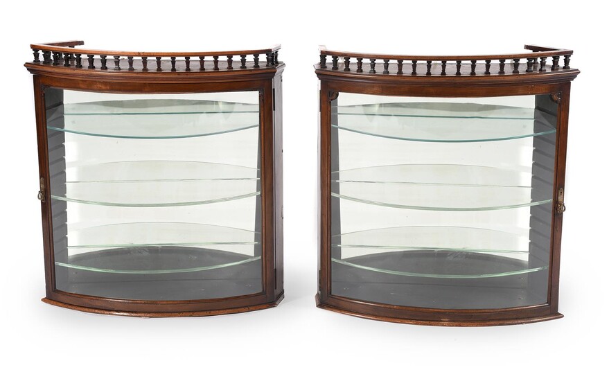 A pair of Victorian mahogany and glazed hanging display cabinets