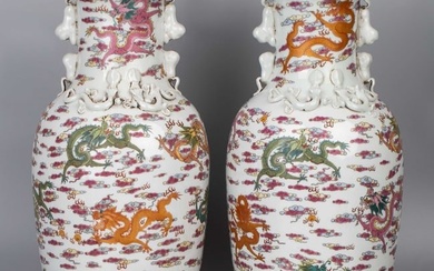 A pair of famille rose dragon pattern animal ears vases with Daqing Qianlong Year Made mark