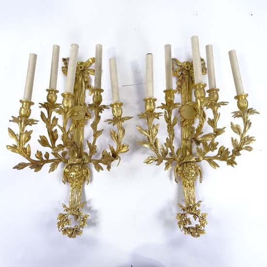 A pair of gilt-bronze 5-branch wall light fittings, decorate...