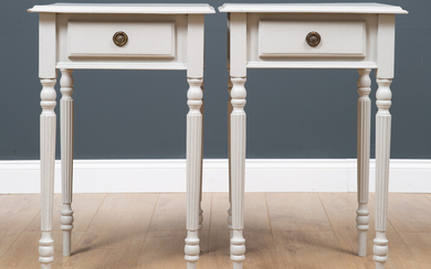 A pair of grey painted square topped side tables